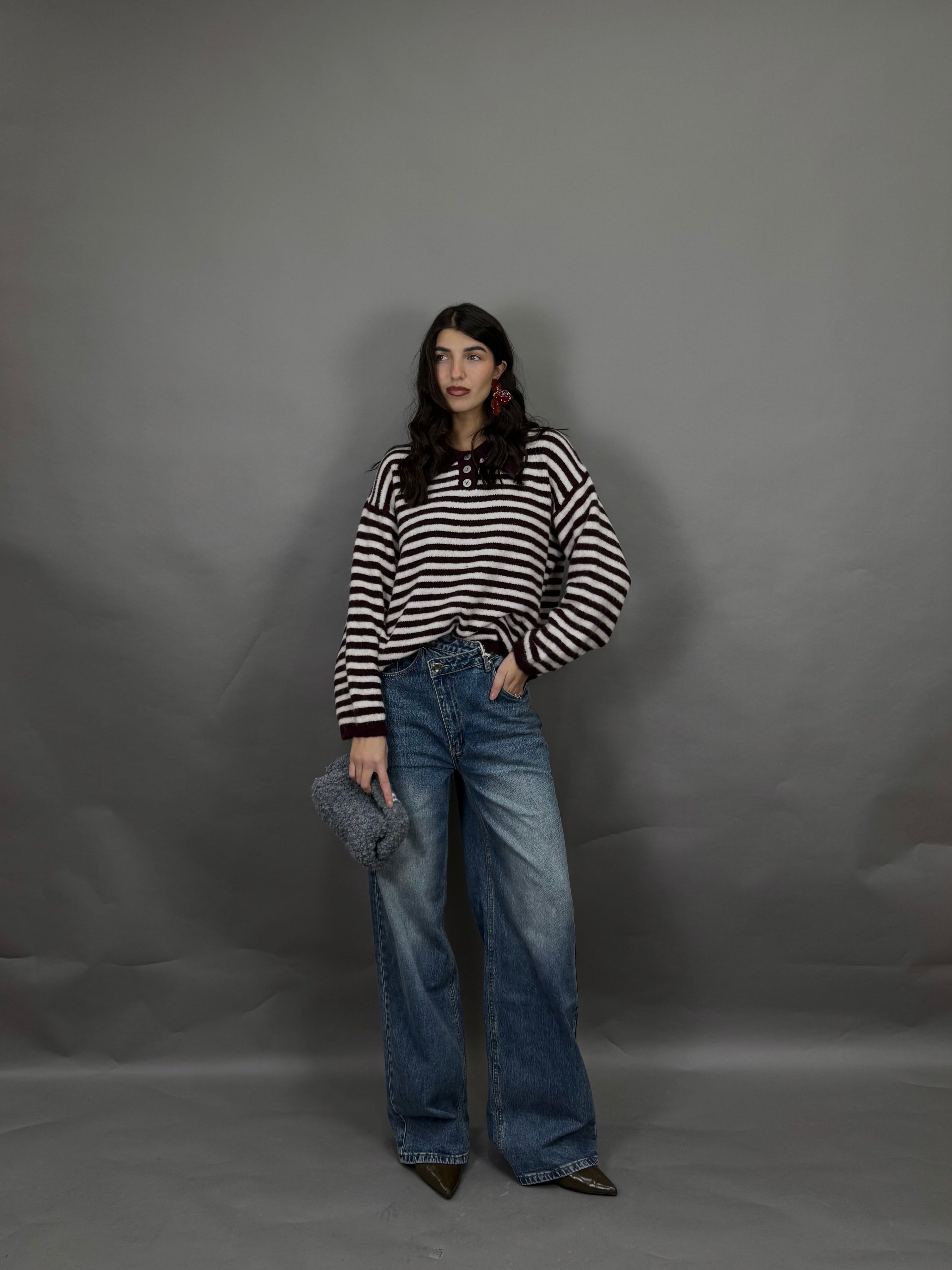 Jeans bottone storto