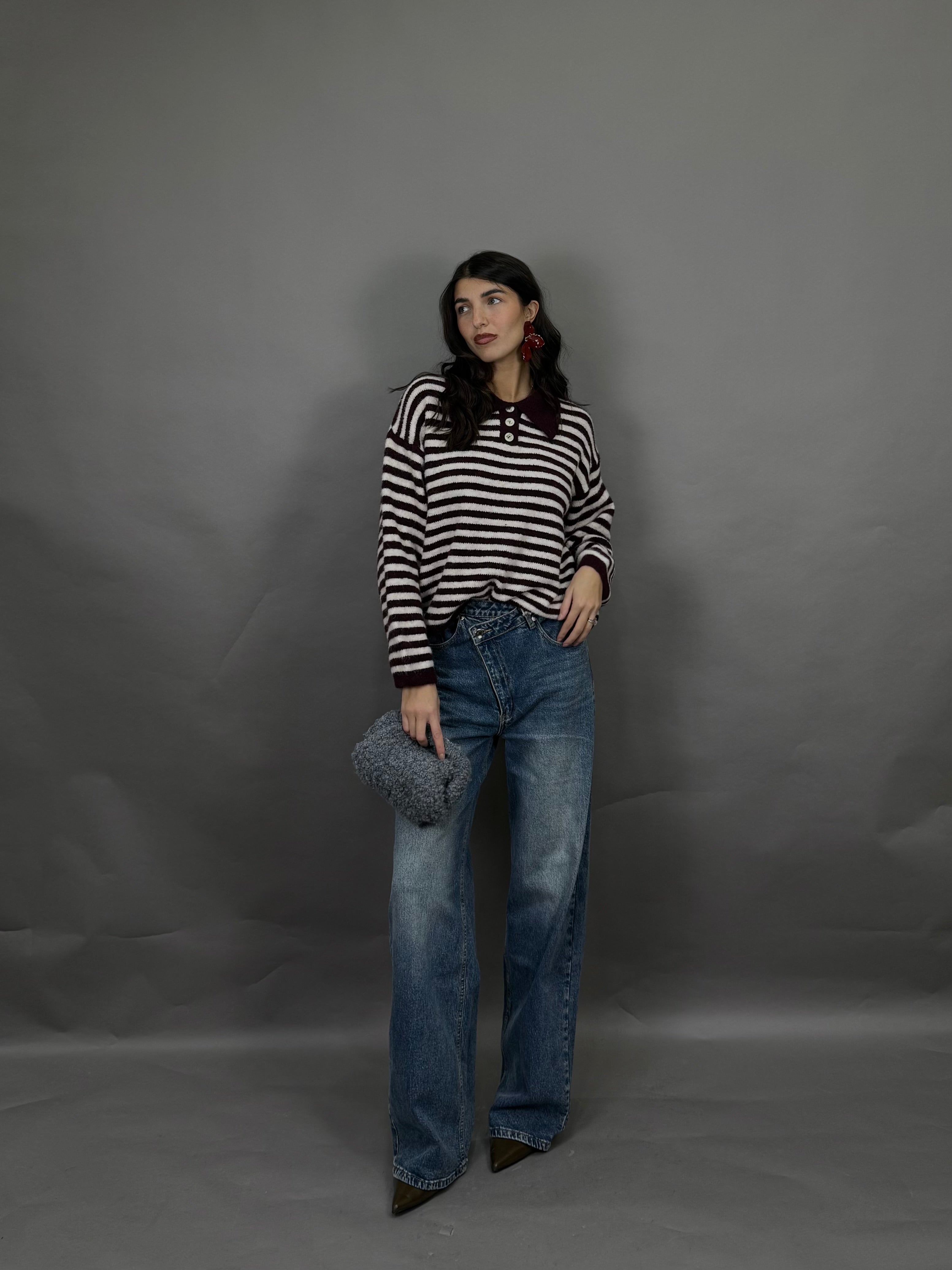 Jeans bottone storto