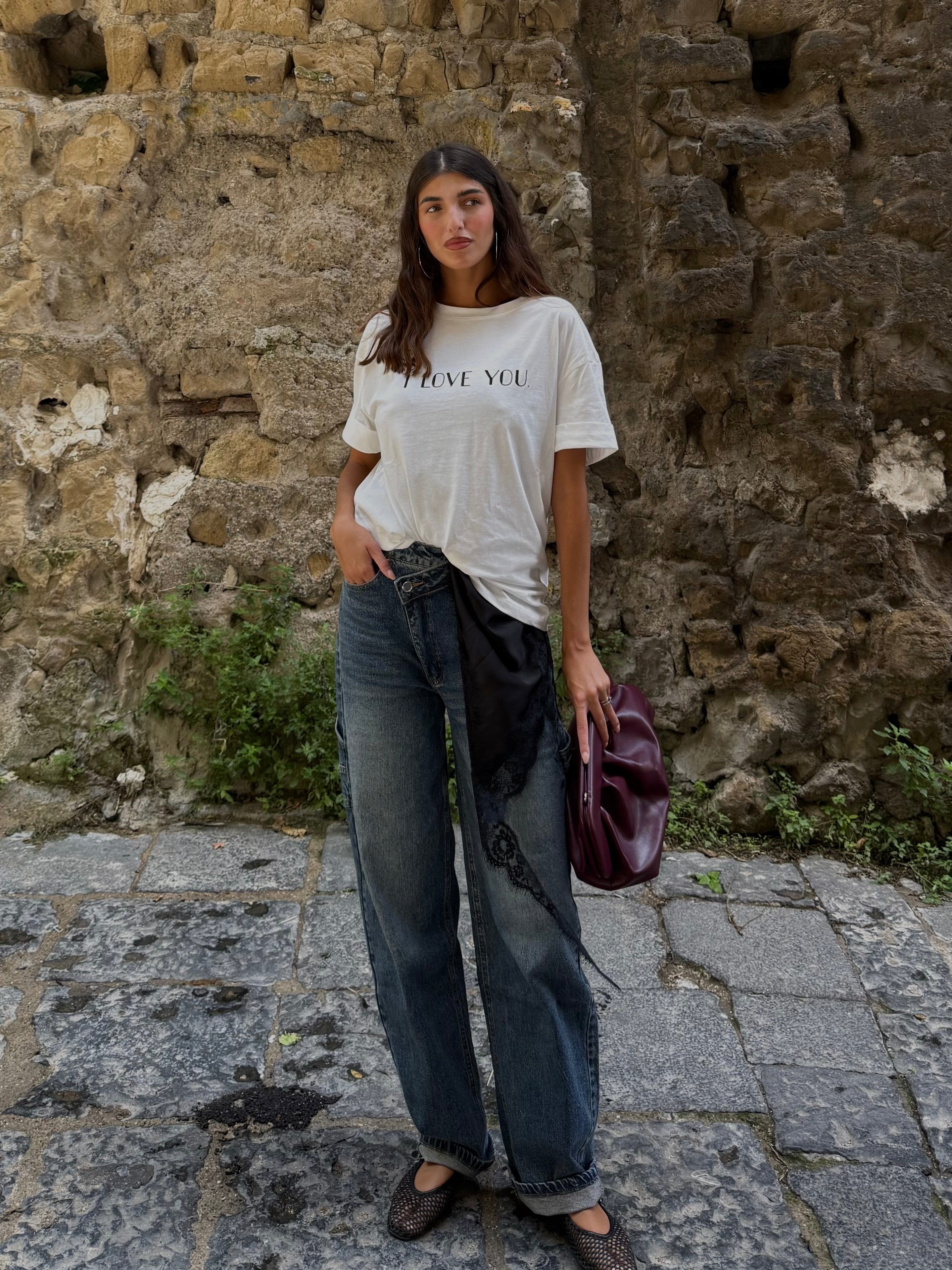 Jeans bottone storto