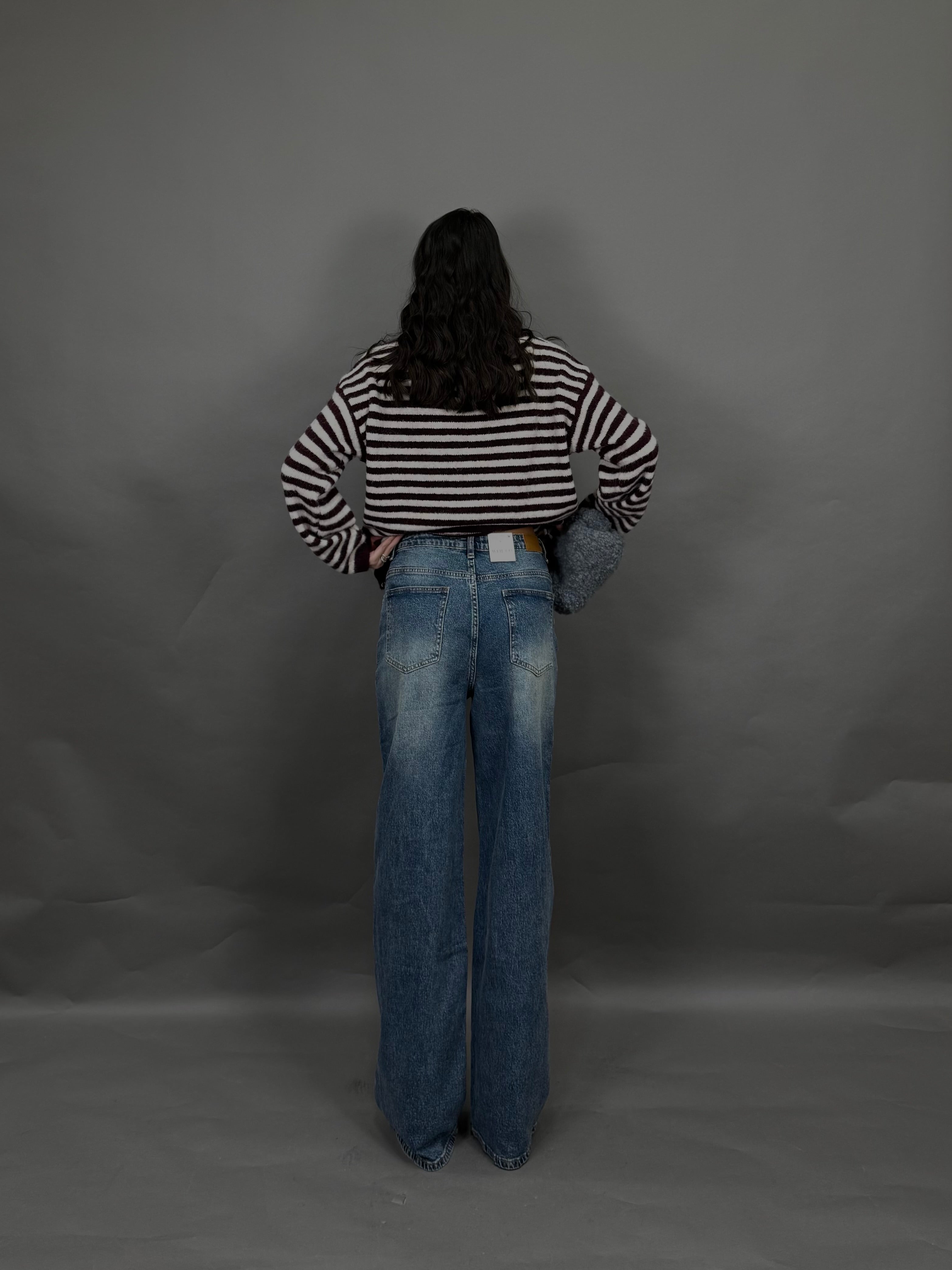 Jeans bottone storto