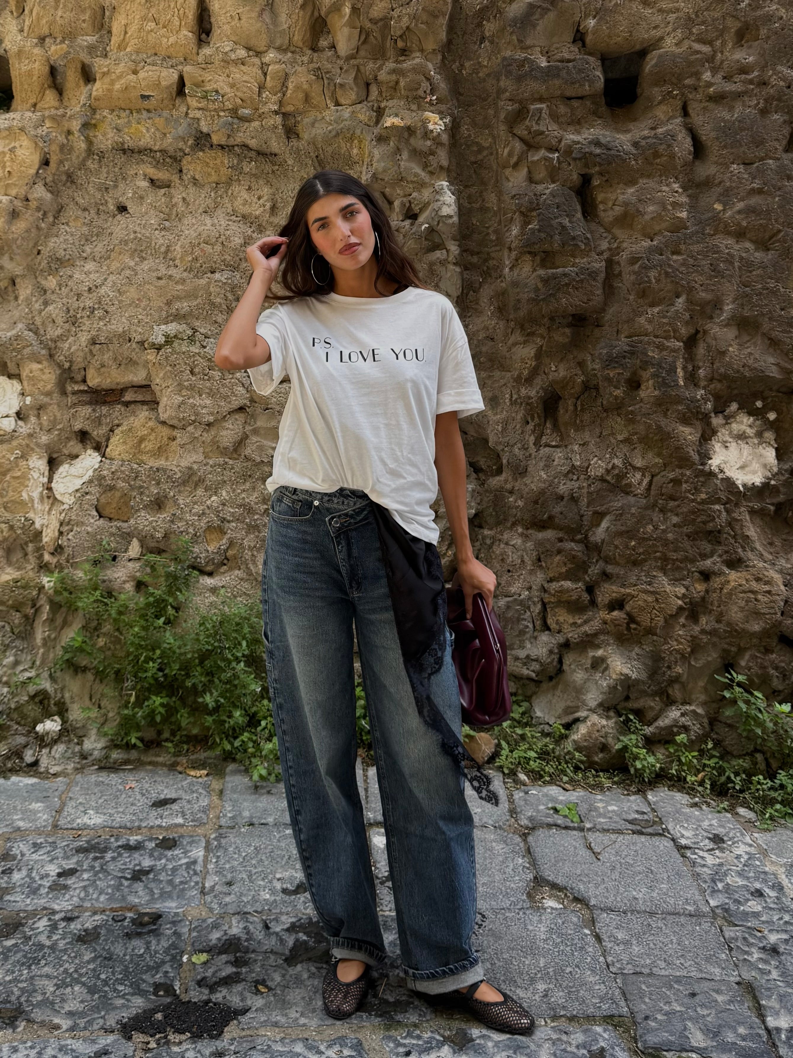 Jeans bottone storto